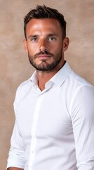 Fototapeta premium A man in a white shirt is posing for a picture