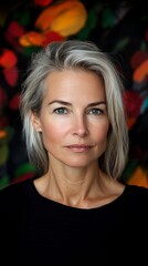Fototapeta premium A woman with grey hair and a black shirt