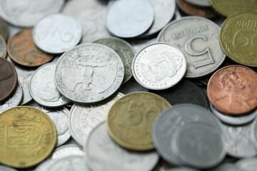 Big pile of different coins from various currencies and different countries around the world. Currency exchange