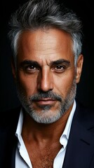 Obraz premium A man with grey hair and a white shirt