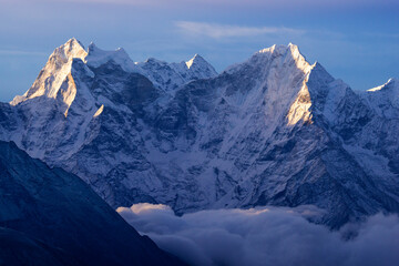 Fototapeta premium Himalayas, Thamserku summit at dawn above the sea of ​​clouds, view from Gokyo Ri peak, Sagramatha National Park