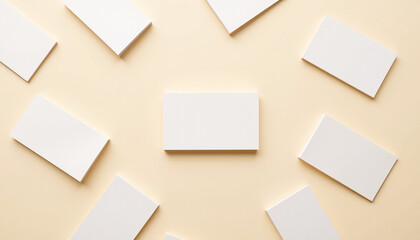Flat lay of white business cards on beige background