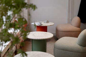 Two tables and chairs in a cafe, cups of coffee on the table.cafe interior