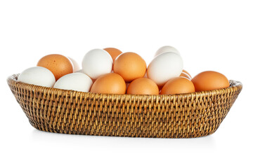 Wicker bowl with raw chicken eggs on white background