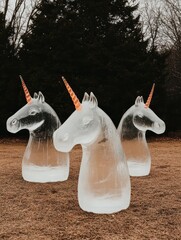 CLOSE UP WIDE ANGLE OF MYTHICAL CREATURES SCULPTED FROM GLOWING.