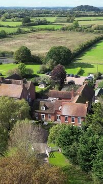 luxury property castle estate hotel basking sunshine england elegance real mansion highlighted against beautiful forward aerial shot drone uk scenic view investment unique 