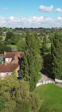 luxury property castle estate hotel surrounded by vibrant sunshine england landscape enhances appeal real circling aerial view mansion drone uk scenic investment unique 