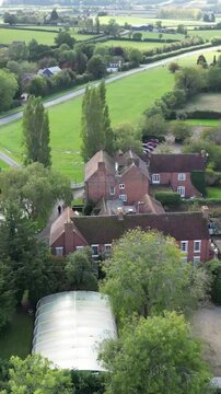 luxurious country house mansion england architecture grounds highlight elegance real estate circling backward aerial drone shot luxury property uk scenic view investment unique 