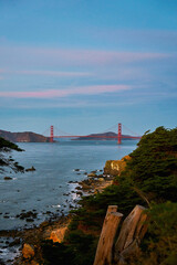 Panoramic view of the large metal red bridge across the bay