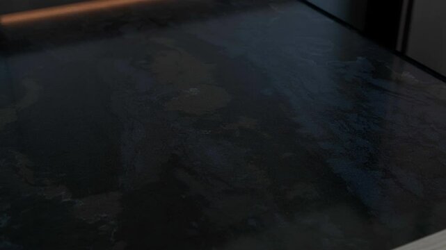 Trendy black quartz stone with luxury background texture. Kitchen countertops with modern interior design and counters. Nobody