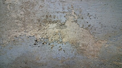 Aged and weathered white wall with multiple cracks and fractures, distressed surface texture background for design and architecture