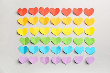 Colorful paper hearts on grey background. Valentine's Day celebration
