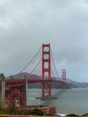 The iconic Golden Gate Bridge spans San Francisco Bay, with a panoramic view of the surrounding...