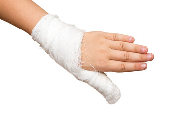 Little girls child hand with gauze bandage and broken thumb finger isolated on white background.