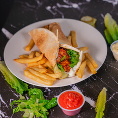 Spicy Chicken Wrap with French Fries and Ketchup on Marble Table

