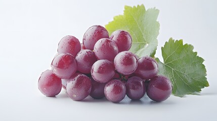 Fototapeta premium Red Grapes Cluster with Fresh Green Leaf