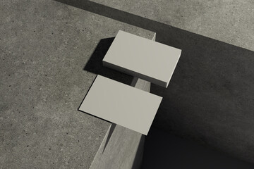 Business Card Mockup on Concrete Blocks with Subtle Indirect Lighting