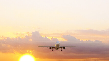 ULTRA HD. Airplane flies in sunset sky. Travel. Airplane takes off against the background of sunset sky.	