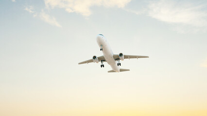 ULTRA HD. Airplane flies in blue sky. Travel, tourism. Airplane takes off against the background of blue sky.  
