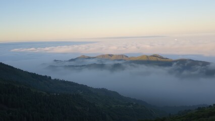 Sunrise Above the Clouds: A Majestic Mountain Vista