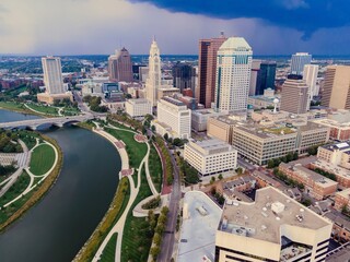 High-angle view of downtown Columbus, Ohio, showcasing the city's skyline, Scioto River, and...
