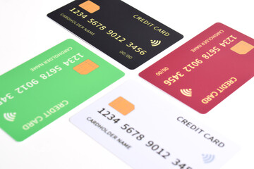 Four credit cards with chip on white background.