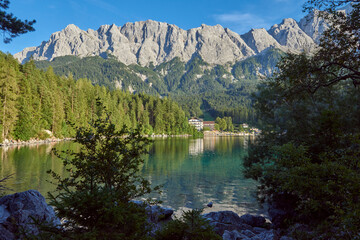 Crystal Clear Eibsee Lake Reflecting Majestic Zugspitze at Golden Sunset: Breathtaking Alpine Landscape Showcases Bavarian Natural Wonder and Outdoor Paradise