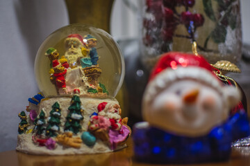 Christmas snow globe and snowman decoration. Festive winter scene.