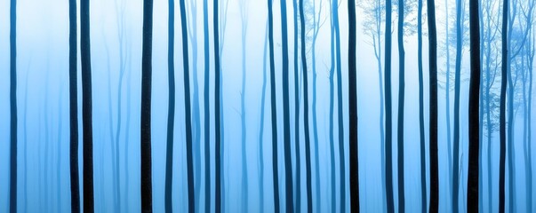 Mist forest concept. A tranquil forest scene featuring tall trees enveloped in blue mist.