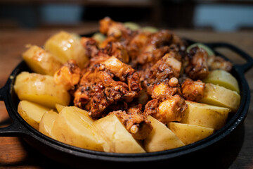 Galician-style Octopus served in black iron pan