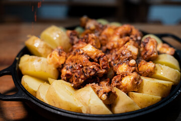 Galician-style Octopus served in black iron pan