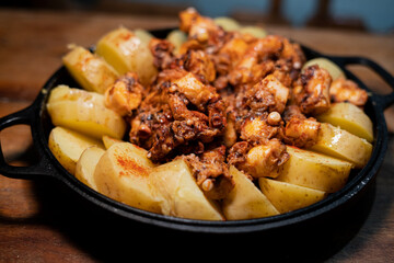 Galician-style Octopus served in black iron pan