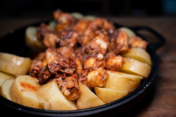 Galician-style Octopus served in black iron pan