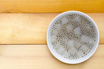 Coconut jelly with basil seeds in syrup