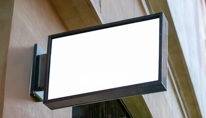 Fototapeta premium rectangle sign mockup on the store wall