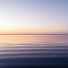 Obraz premium Serene sunset over calm water, pastel hues.