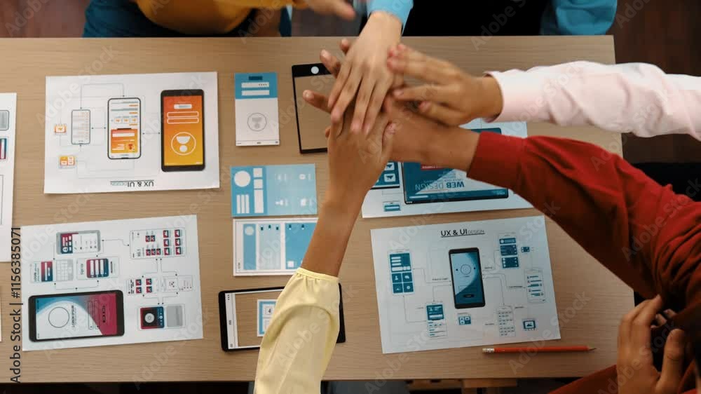 Aufkleber top view video of startup company ui or ux developer joining hand over user interface prototype for 