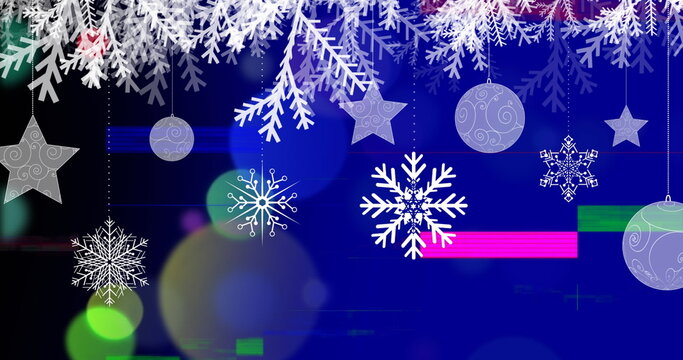 Digital image of glitch technique and christmas decorations moving on blue background