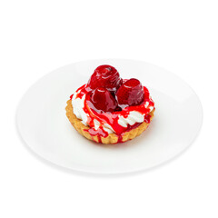 Dessert tartlet with cream and strawberries, on a white background, isolated.