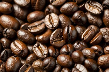 Fototapeta premium A close up of coffee beans with the idea of a coffee bean farm. Scene is warm and inviting