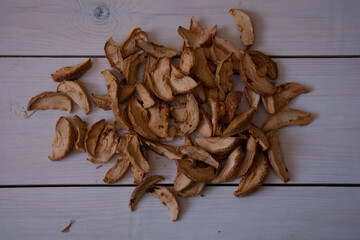Dried apples on a background of white boards