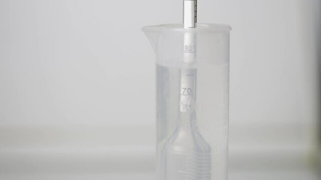 Distillation of braga into moonshine. Measurement of alcohol content.