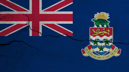 Cayman Islands flag on cracked wall background, flag with crack line
