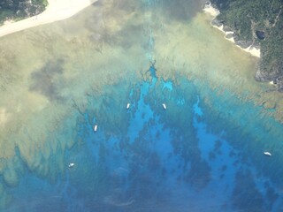 Aerial view of fringing coral reef and vessels, Keramashoto, Okinawa, Japan