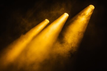 Golden Stage Lights in Smoky Atmosphere