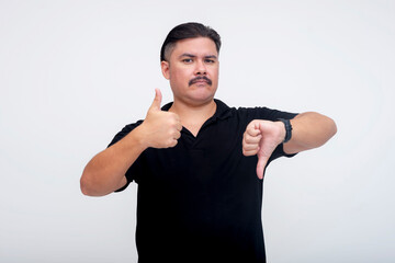 A stocky middle aged man with a mustache giving mixed signals, both thumbs up and thumbs down. Set...
