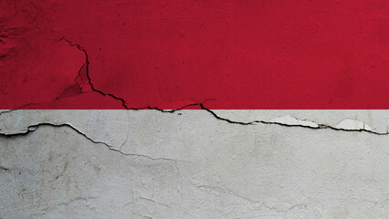 Monaco flag on cracked wall background, flag with crack line