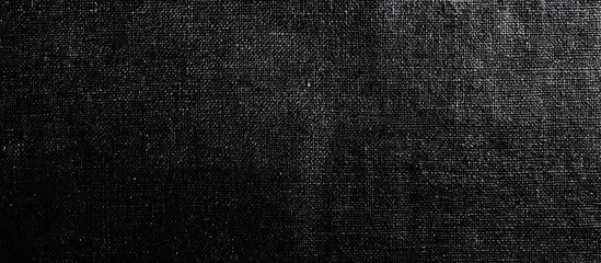 Black Fabric Texture Background Suitable for Text Overlay with Ample Copyspace for Design and Creative Projects