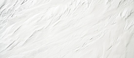 Fototapeta premium Texture of freshly groomed ski slope showcasing smooth lines and ample space for text or design elements in a winter landscape.