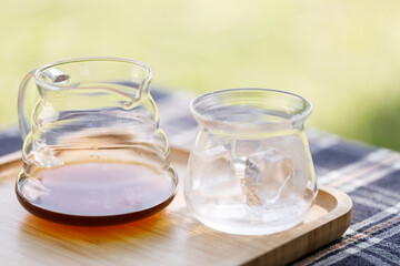 a kettle of coffee and a glass of ice